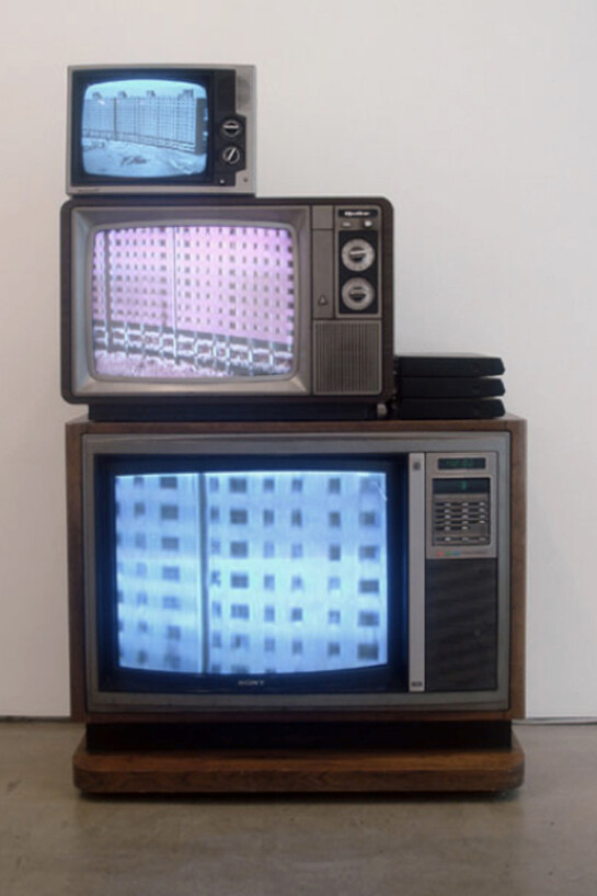 Jonathan Calm, Scudder Towers Down, 2008, Video with sound on three stacked vintage monitors, 57 X 36 X 19 Inches, Unique. Courtesy of LMAKprojects, NY  