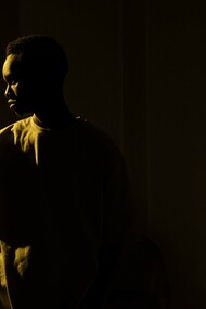 Person standing alone in the dark 