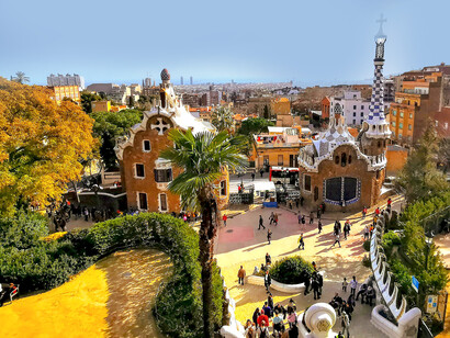A view of Park Güell in Barcelona, Spain, showcasing its famous mosaic benches and artistic design