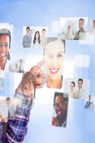 Engaging with technology dependence, a woman selects images of people through VR glasses, illustrating the contemporary embrace of modern tech