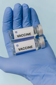 Doctor's hands holding vaccine