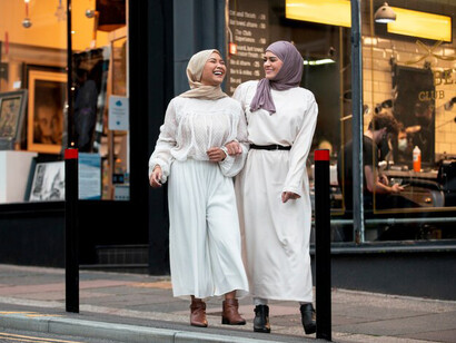 Hijabi women walking together, enjoying their time outdoors