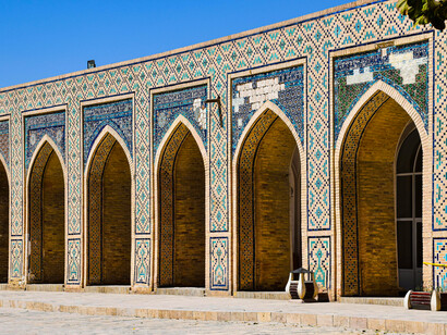 Mosaic-tiled arches in the courtyard of the Poi Kalan Mosque, Bukhara, Uzbekistan