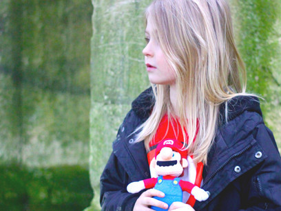 A young child facing economic hardship in St. Lawrence, Ramsgate, UK, representing the broader issue of financial inequality and its effects on childhood development