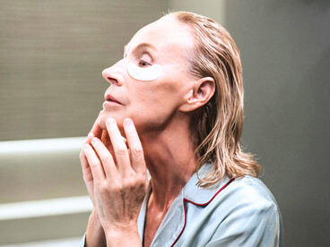 A woman beginning her morning regimen, echoing the idea that aging is increasingly modifiable