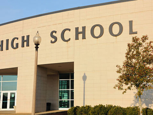 Students gathered near the high school entrance as the bell rang